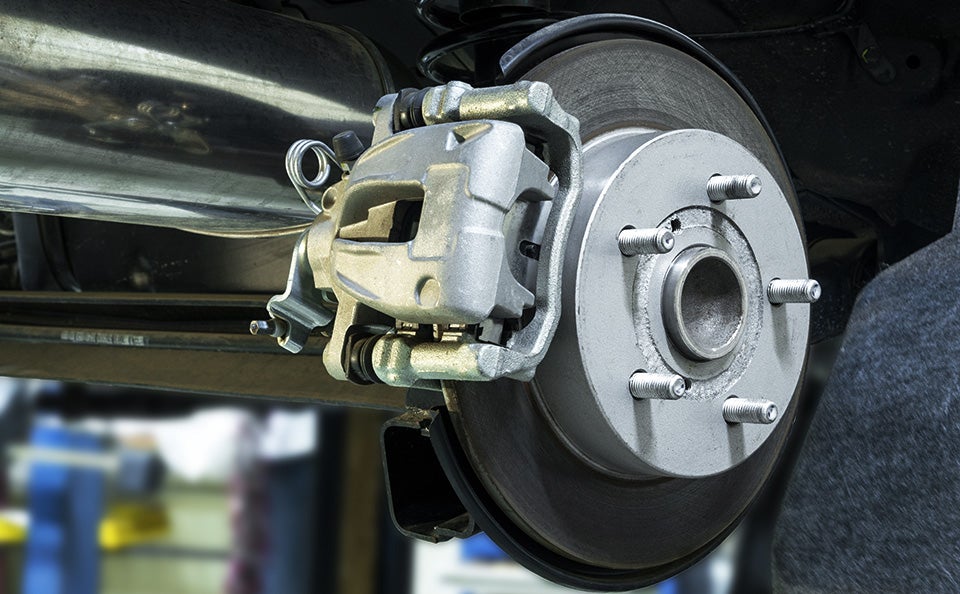 An image of a complete new brake installation on a car before the wheel is replaced.